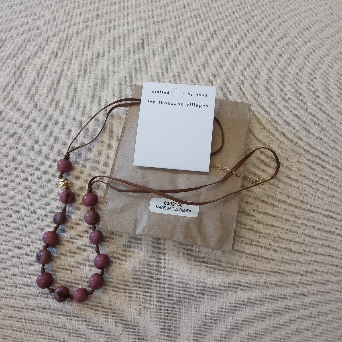 Necklace acai seed/suede/steel 19L lav/brn/gld