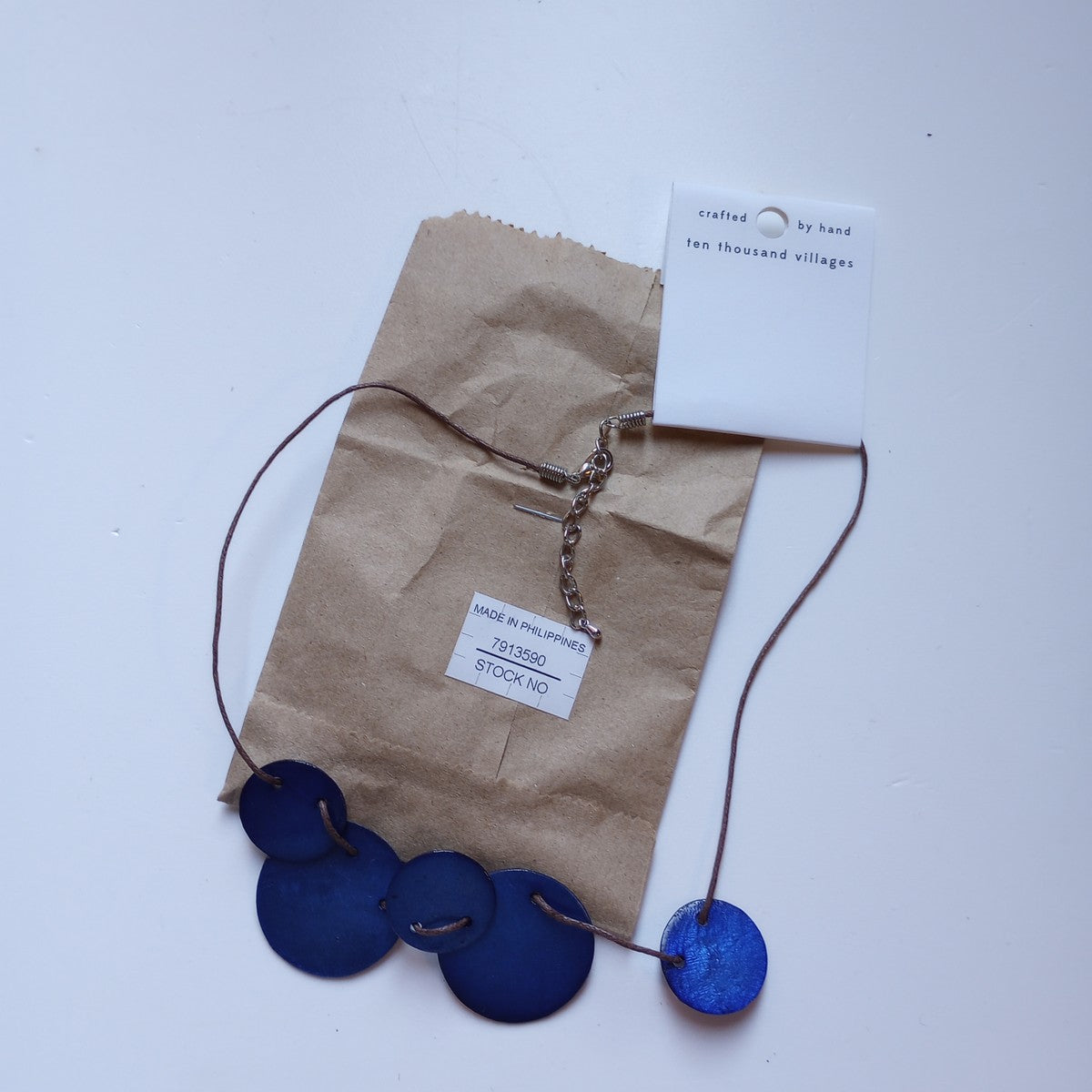 Necklace 5 threaded discs capiz/cord 18L blu/brn