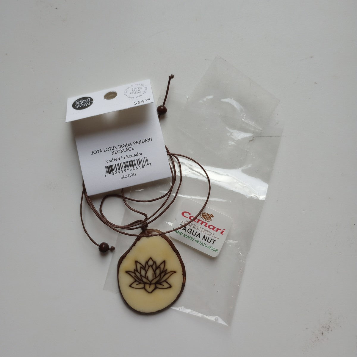 Necklace lotus pendant tagua/cord 16L nat/brn
