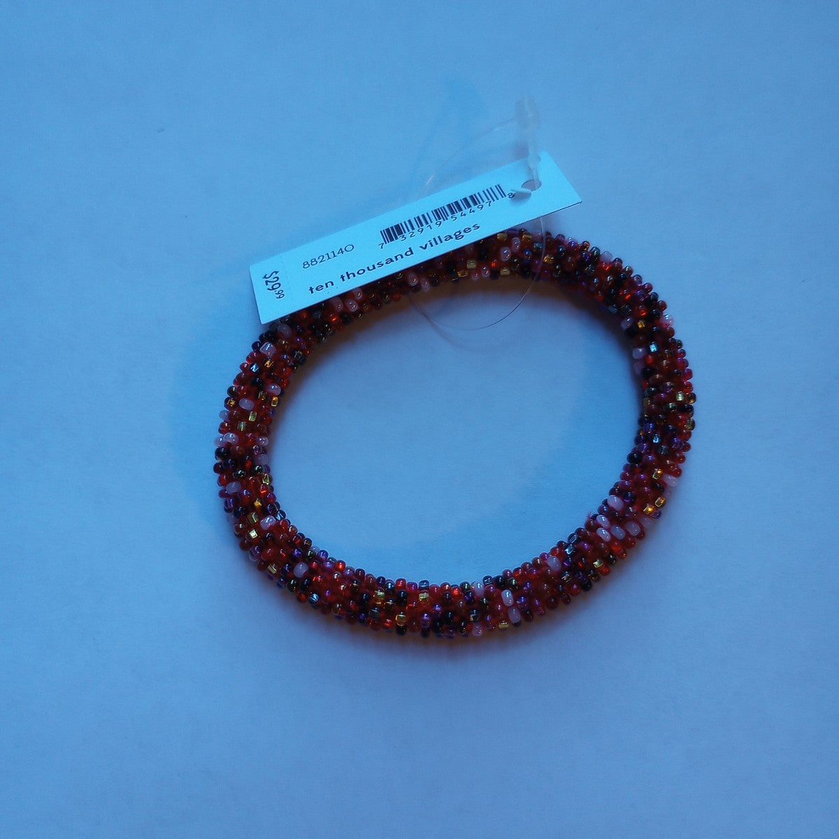 Bracelet beaded tube cotton/glss 2.75D rd/prpl/gld