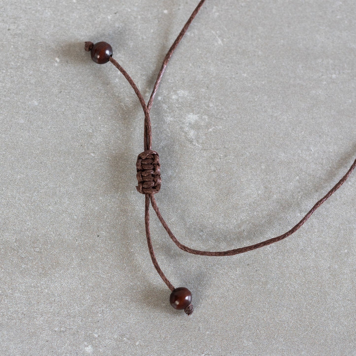 Necklace lotus pendant tagua/cord 16L nat/brn