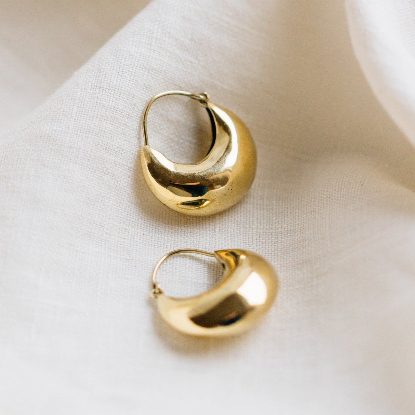 Earrings puffed crescent hoop brass 1.25L brass