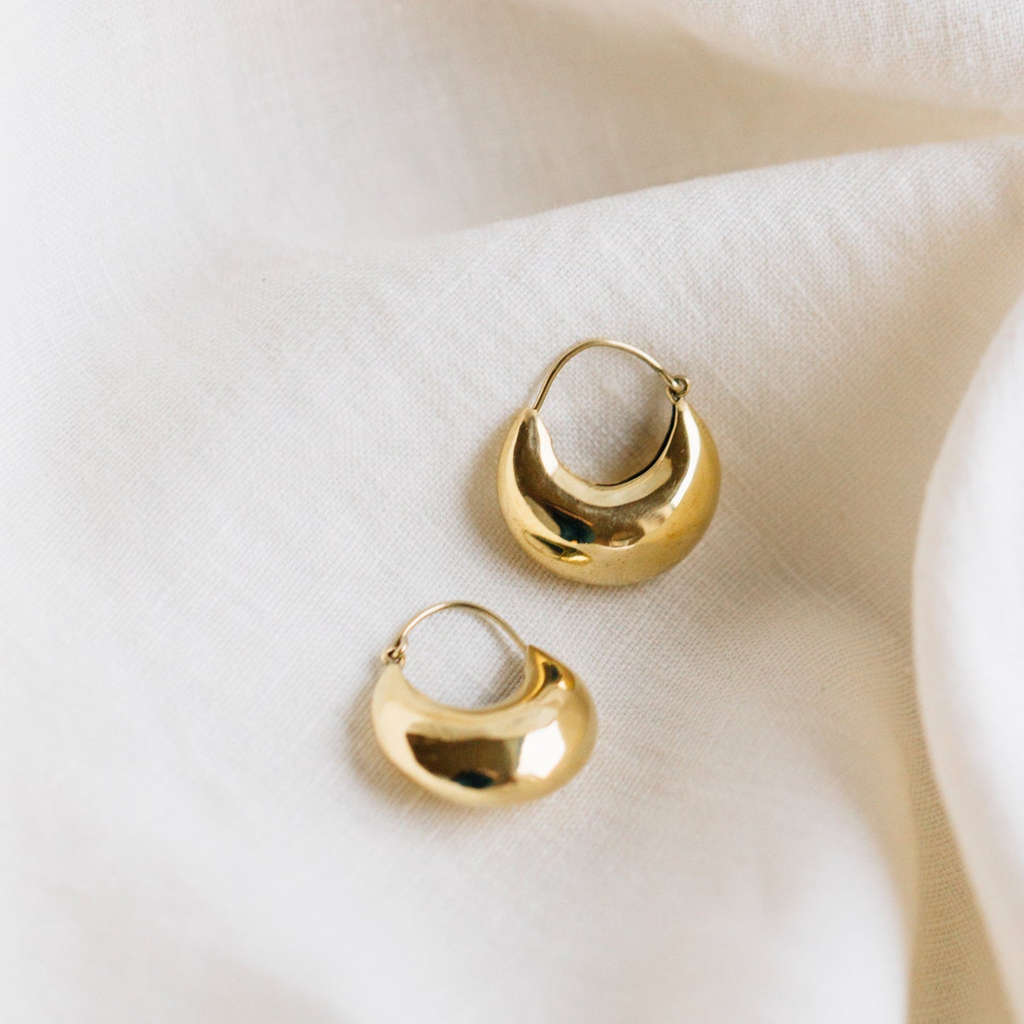 Earrings puffed crescent hoop brass 1.25L brass