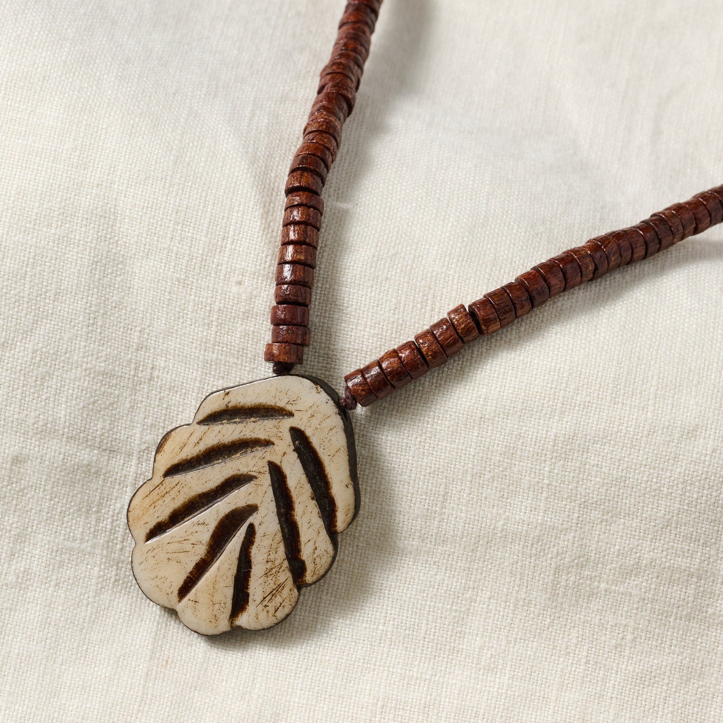Necklace pend sm beads bone/wood/cord brn/tan