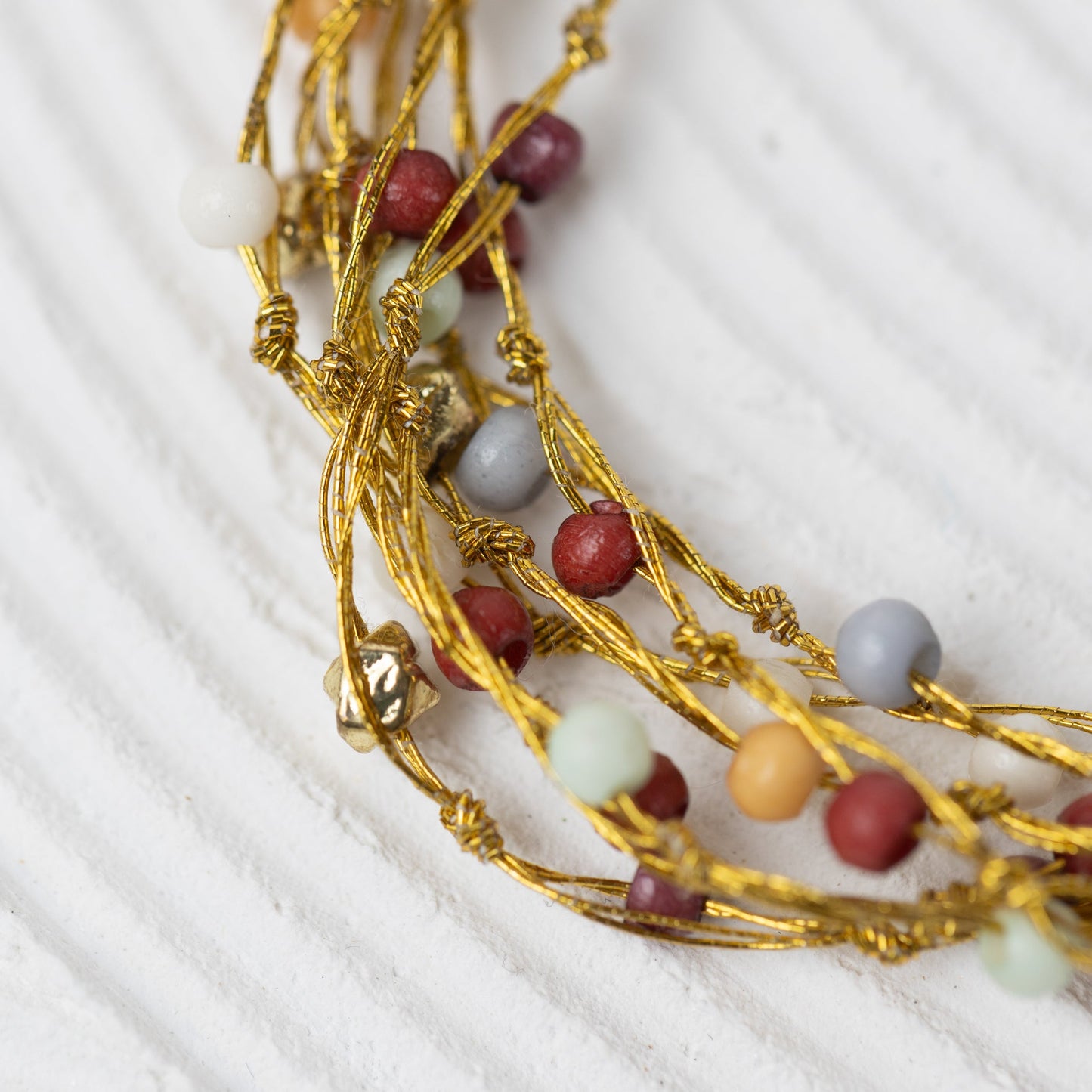Necklace multistrnd bd bone/zari 17L br/wht/orng