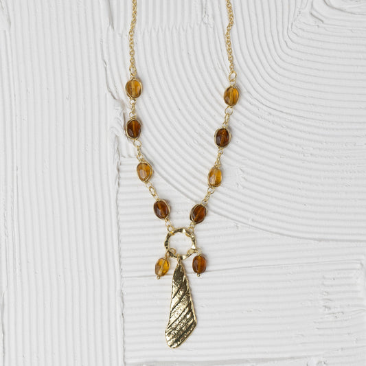 Necklace bead w/pendant br/glss 24L yel/brn/brass