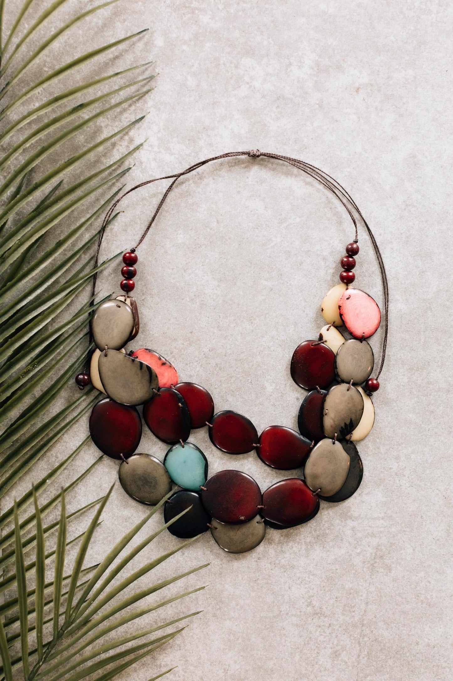 Necklace 3 tier linked tagua/cttn 34L red/brn/teal