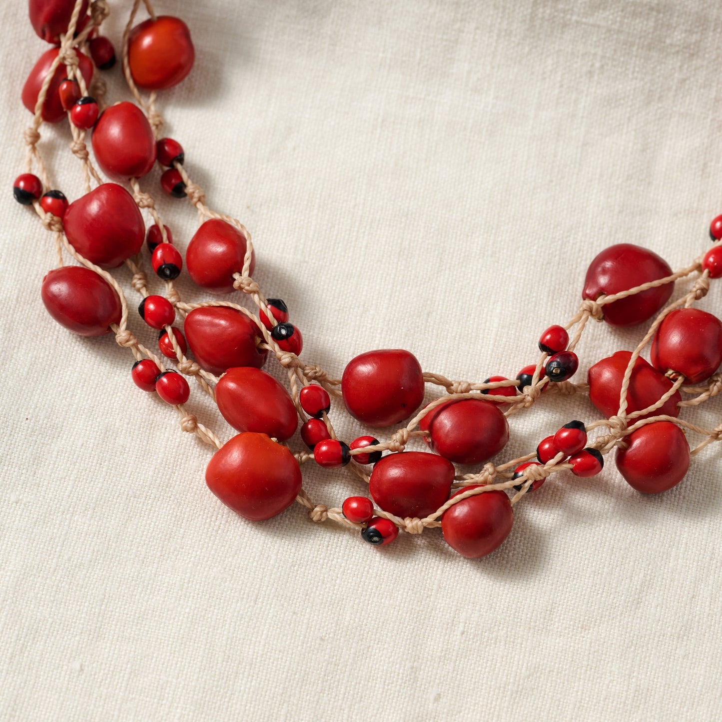 Necklace multistrand seeds/cord adj red/brown