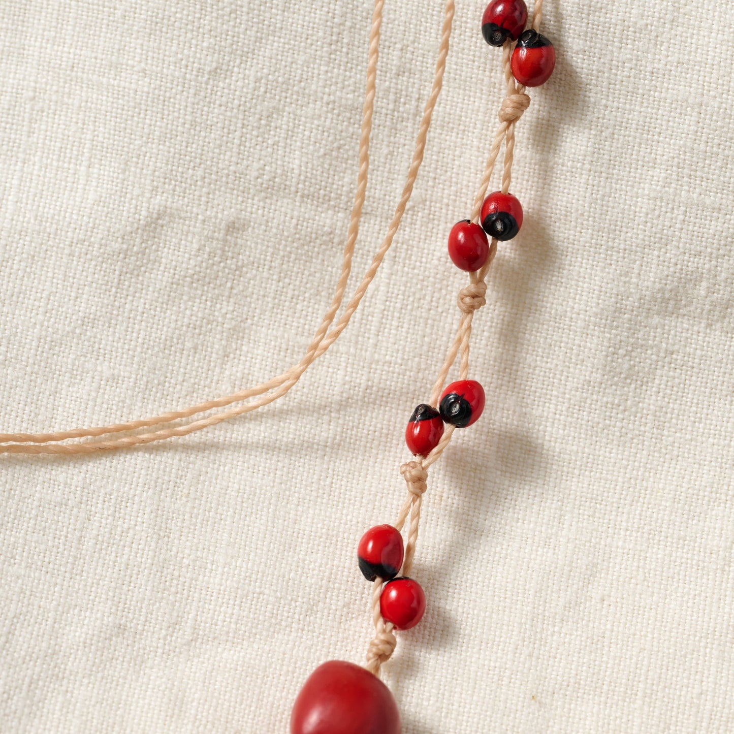 Necklace multistrand seeds/cord adj red/brown